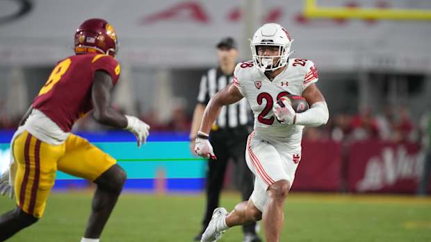 Oct 21, 2023; Los Angeles, California, USA; Utah Utes safety Sione Vaki (28) carries the ball against the Southern California Trojans in the first half at United Airlines Field at Los Angeles Memorial Coliseum. Mandatory Credit: Kirby Lee-USA TODAY Sports